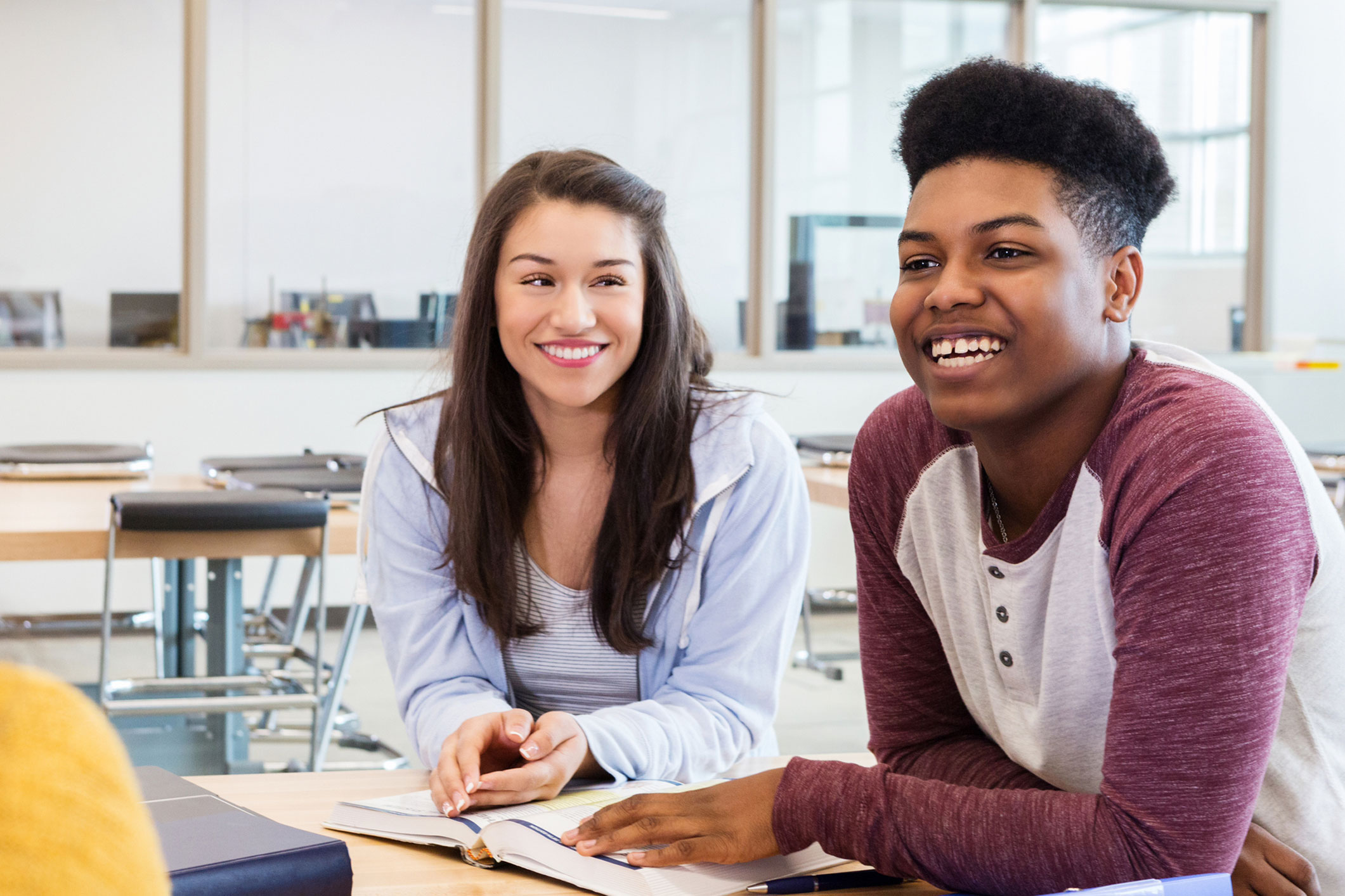 students smiling at each other