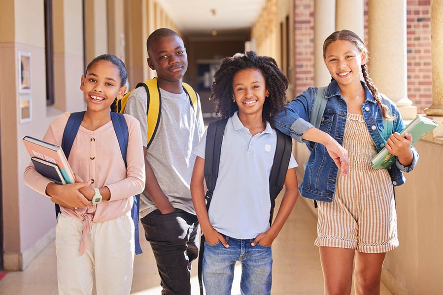group of diverse middle school students in school