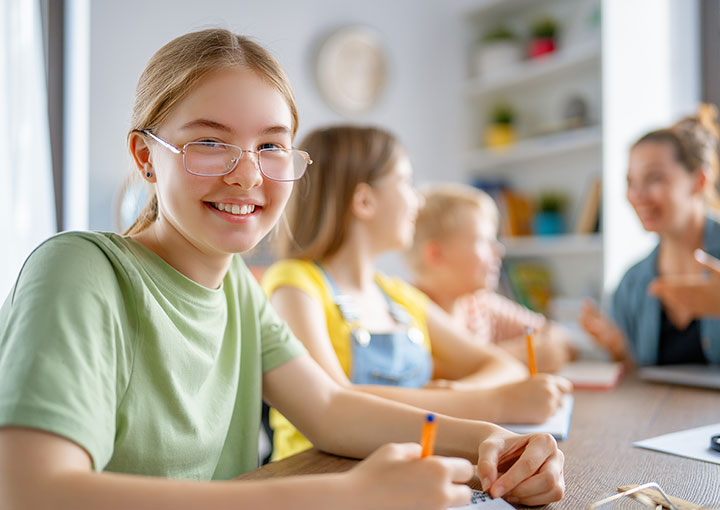 happy young girl in classroom